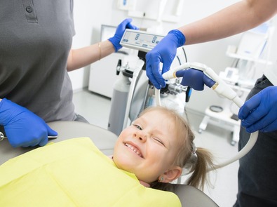family child in dental chair